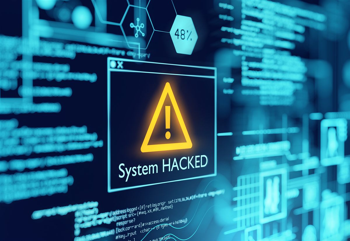 Bildschirm mit Warnmeldung „System Hacked“